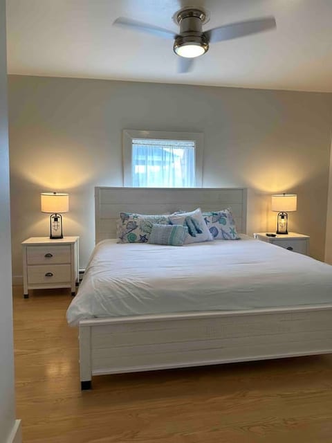 Master bedroom with king bed and private balcony overlooking Ocean Park with breathtaking ocean views.