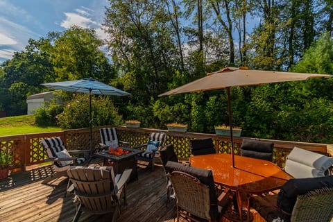 Enjoy relaxing around a fire in the evening on the large back porch.  Open the umbrellas and read your favorite book in the shade. The porch leads to an enclosed fenced lot so your pups can play by your side.