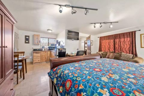 A sofa compliments the king sized bed.