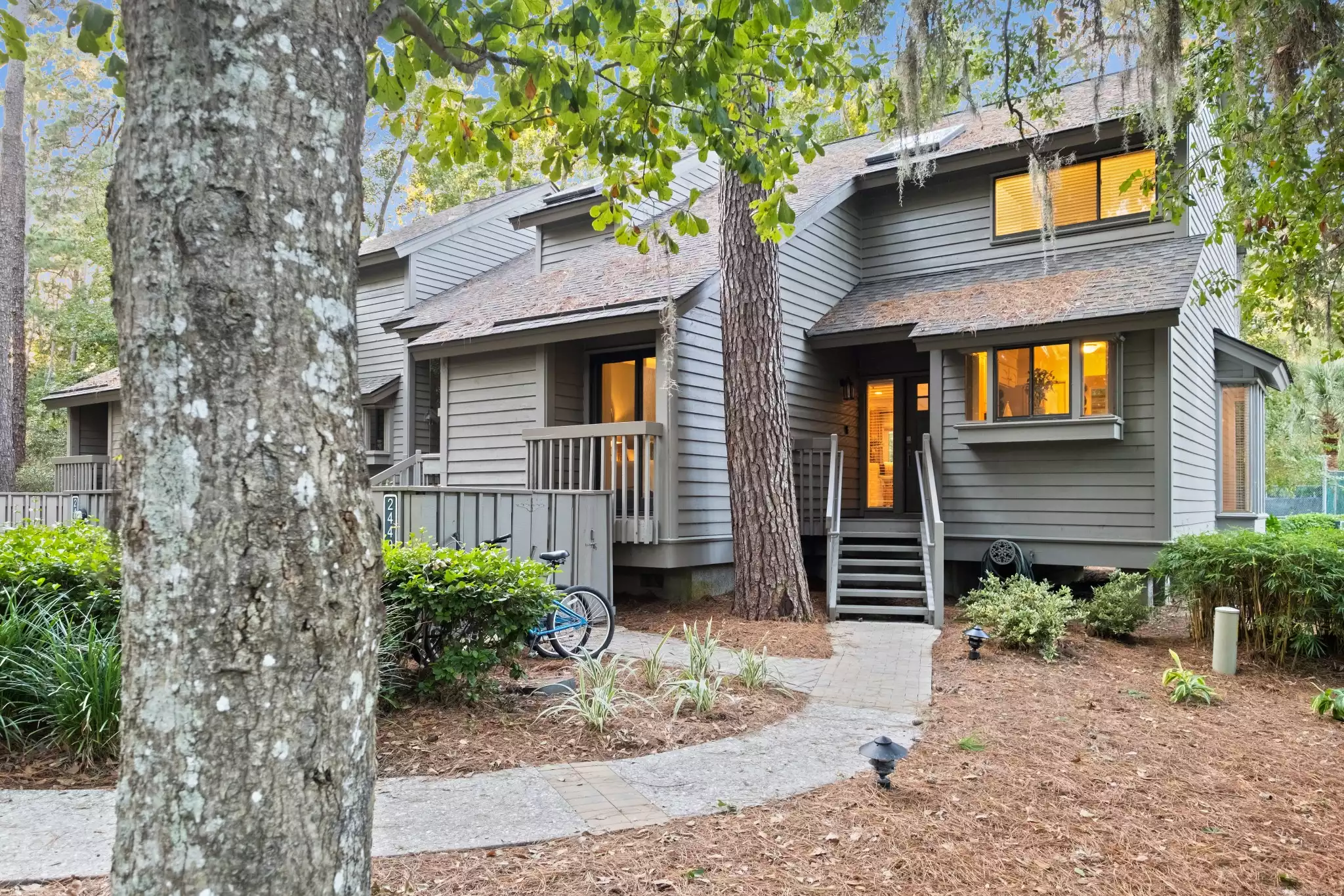 Front of villa with wide parking spot out front and lighted walkway - Island Song Villa - Hilton Head Island