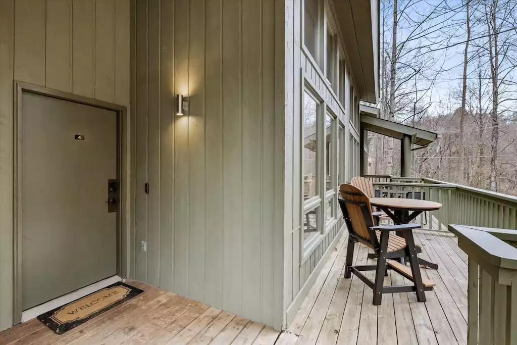 Private entry with smart door lock and ring doorbell camera for added security.