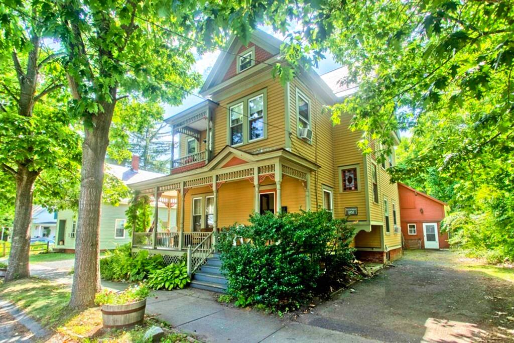 The Blooming Inn Front elevation summer view - Balcony Room in Victorian Home with private bath - Shelburne Falls