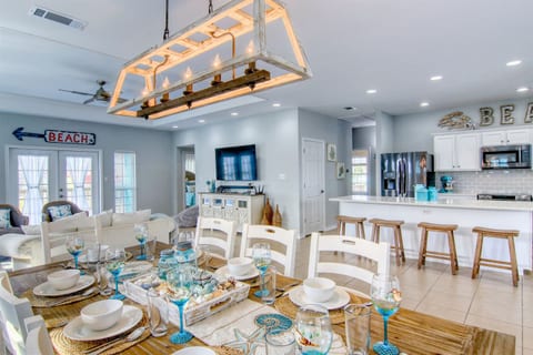 Dining area offers a view of the kitchen and living room. The space is open, perfect for entertaining and hanging out with family.