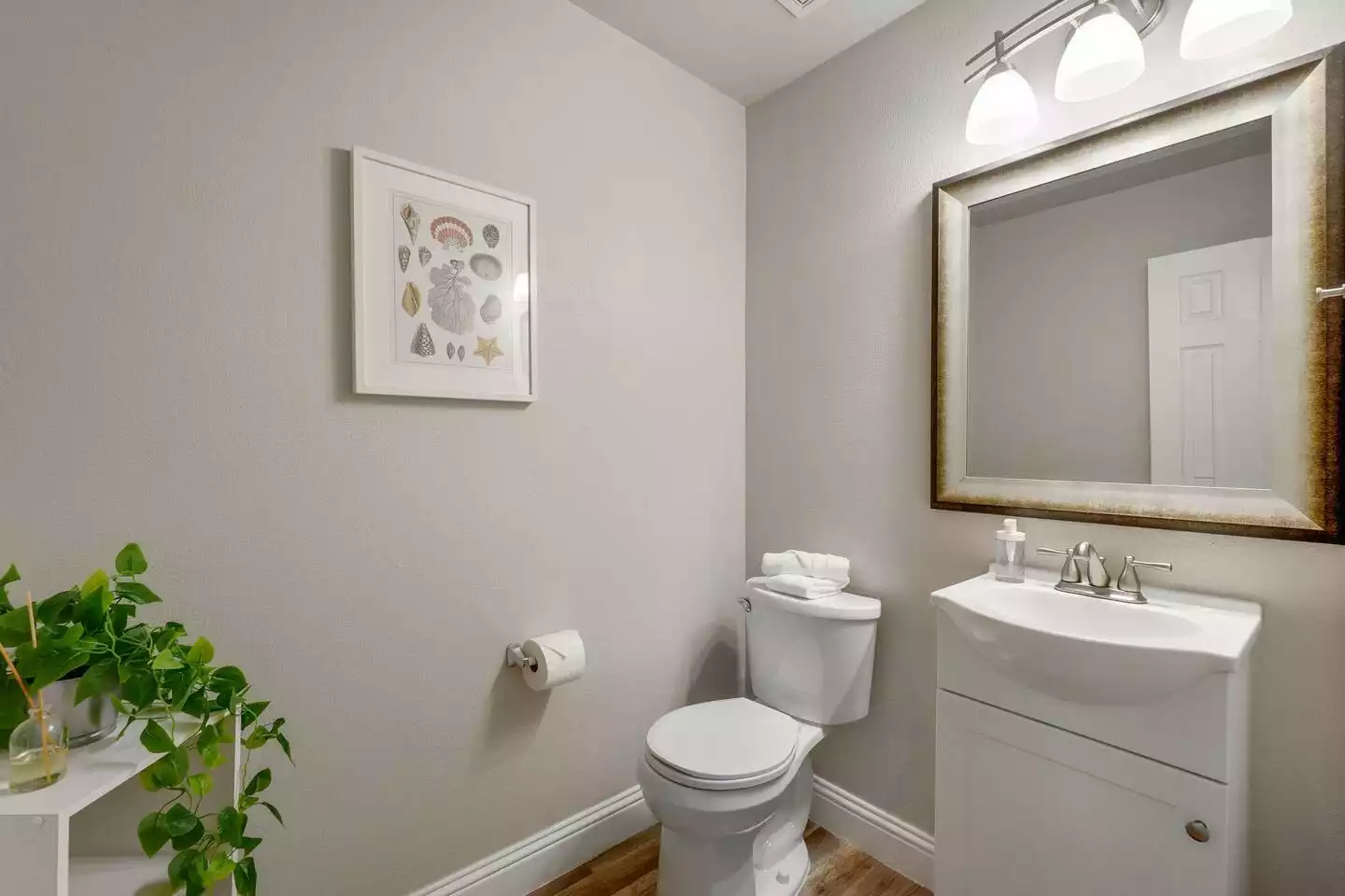 A small downstairs powder room to freshen up before you head out for the day. A small downstairs powder room to freshen up before you head out for the day. - The Coastal Breeze - Keller