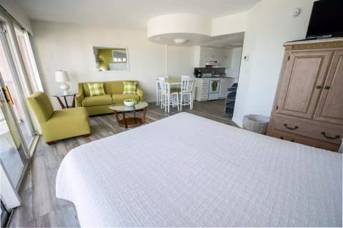 Queen bed in living room area