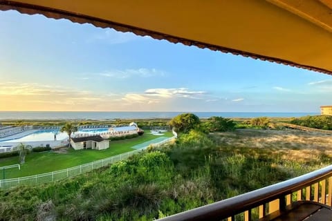 View from our condo's oceanfront balcony - Panoramic Ocean, Pool & Coastal Marsh!
