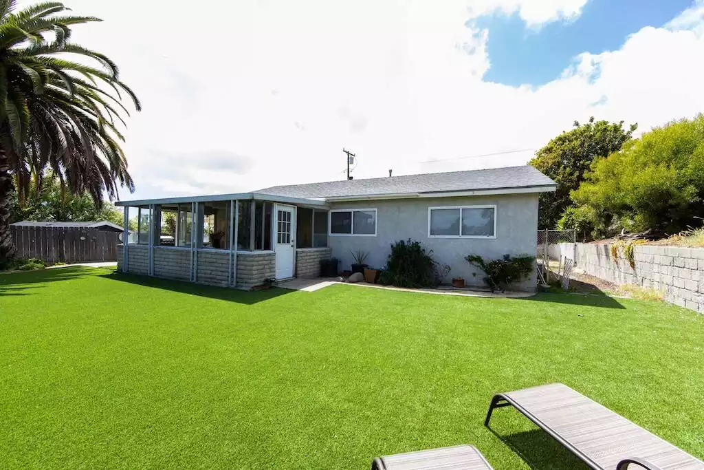 Plenty of room for the pups and kiddos to play in the backyard. - Bluff Bungalow  - Oceanside