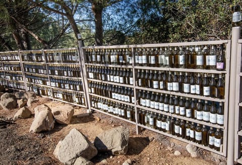 Wine bottle wall at Casa de Piedra