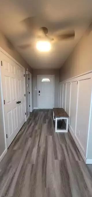 Entry hall with a bench to set your bags on or take off your shoes and stay a while!