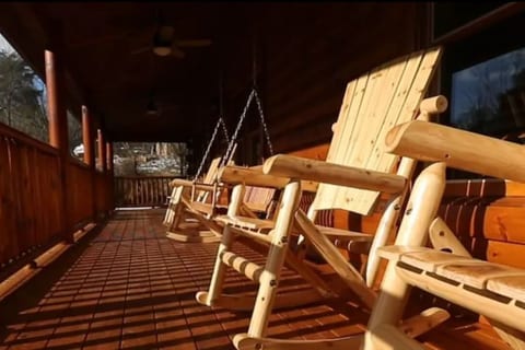 Back Porch with very nice rocking chairs and a swing