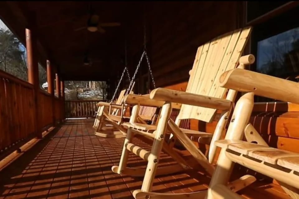 Back Porch with very nice rocking chairs and a swing