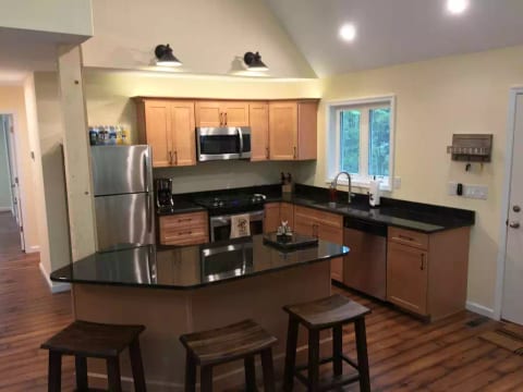 Eat in kitchen, high end appliances and gas range compliment any chef.