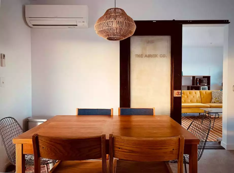 Dining space for four. Table extends from this photo to accommodate six and a bigger meal. Each room includes a mini split unit that allows for adjustable heating and a/c. - The Filmmakers House - Joshua Tree