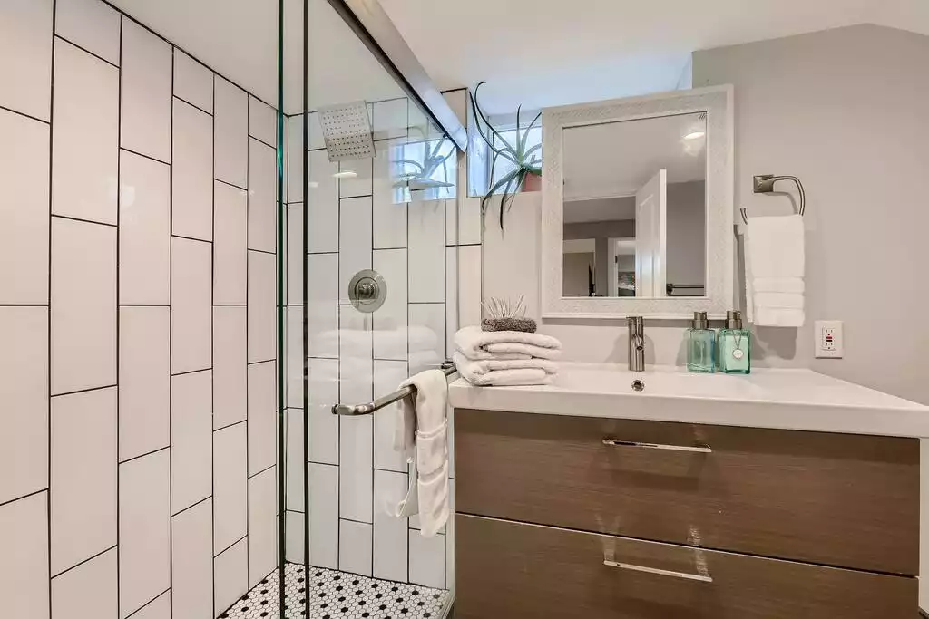 The large waterfall shower offers plenty of room to steam and decompress.