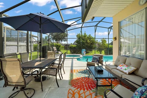 Lovely screened in lanai and pool/spa area