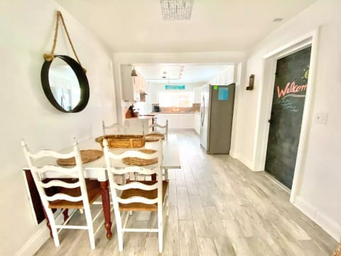 The dining table has a drop leaf which can be extended to seat the whole family.