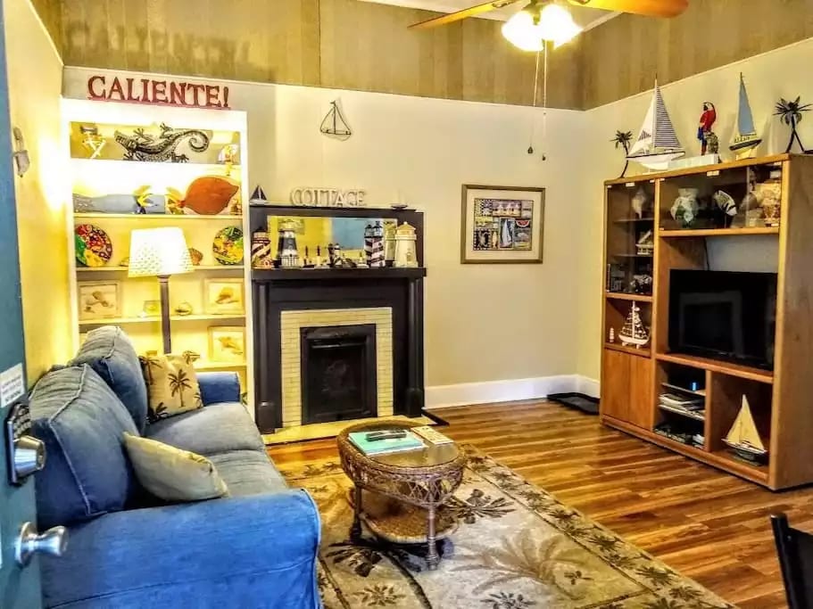 Nice living room with pull out couch bed & 42" smart tv w/Comcast & voice remote.