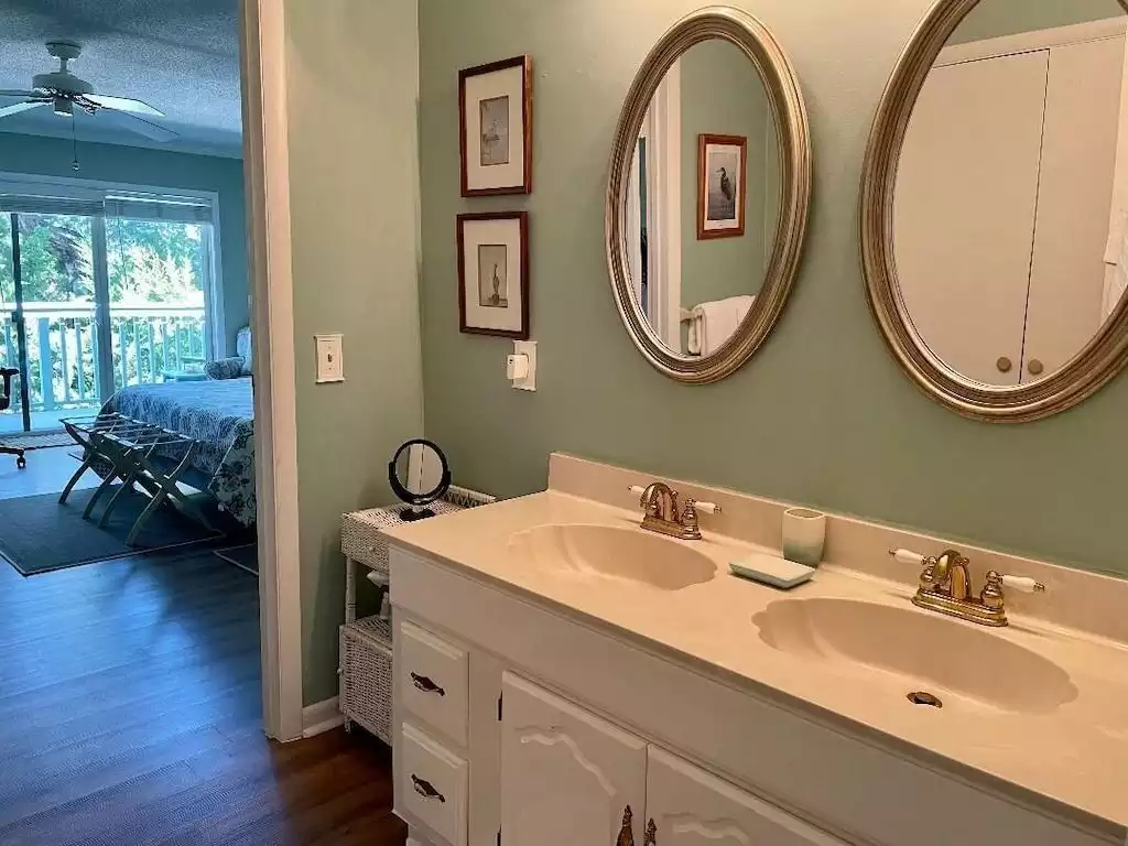 Master bath features separate powder/dressing area with large closet. - Seas The Day - Saint Simons Island