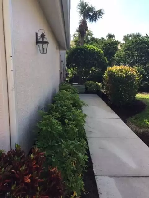 This condo has a side entrance as it is an end unit.