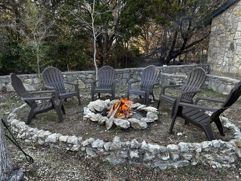 Outdoor fire pit with stone surroundings