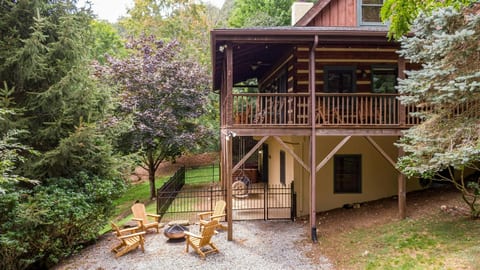 Small pet run area and fire pit with Adirondack chairs