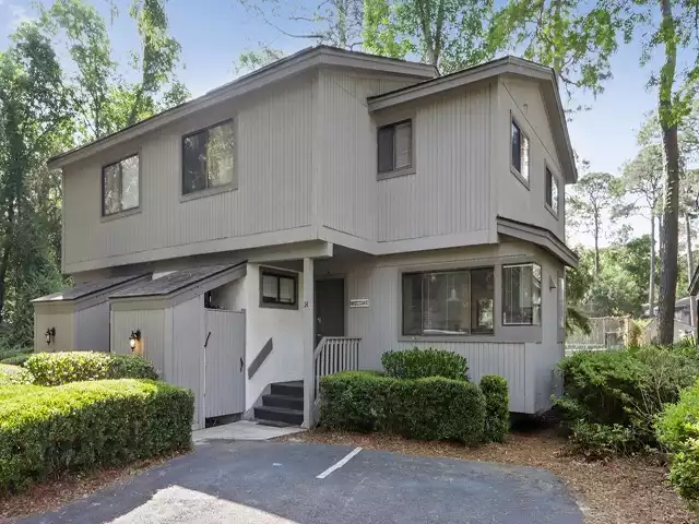 Small density complex with 2 assigned parking spots right across from beach!