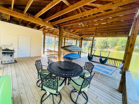 Dock with 3 adult kayaks, 2 children’s kayaks, gas grill, and ample seating