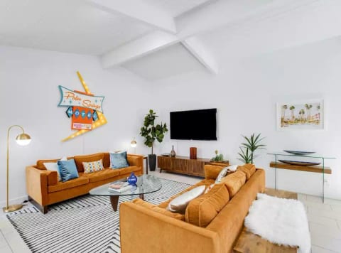 Living Room with 63" Roku TV. Plenty of seating areas to watch a movie or play board games.