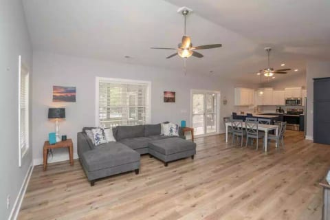 Large Living Area with open plan: Living room, dining area, and kitchen.