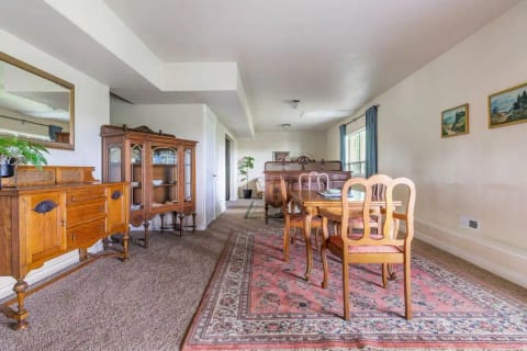 The private suite is separated from the rest of the house with a locked door (down a hallway and up the stairs behind the china cabinet). The cabinet is there to keep kids and pets from wandering up the stairs, for their safety.