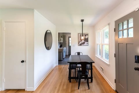 The dining room features an expandable dining table for 6-10 is adjacent to the living area.