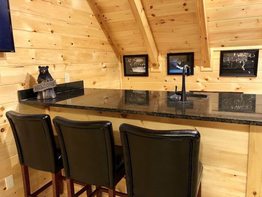 Wet Bar in the Game Room with refrigerator behind the bar