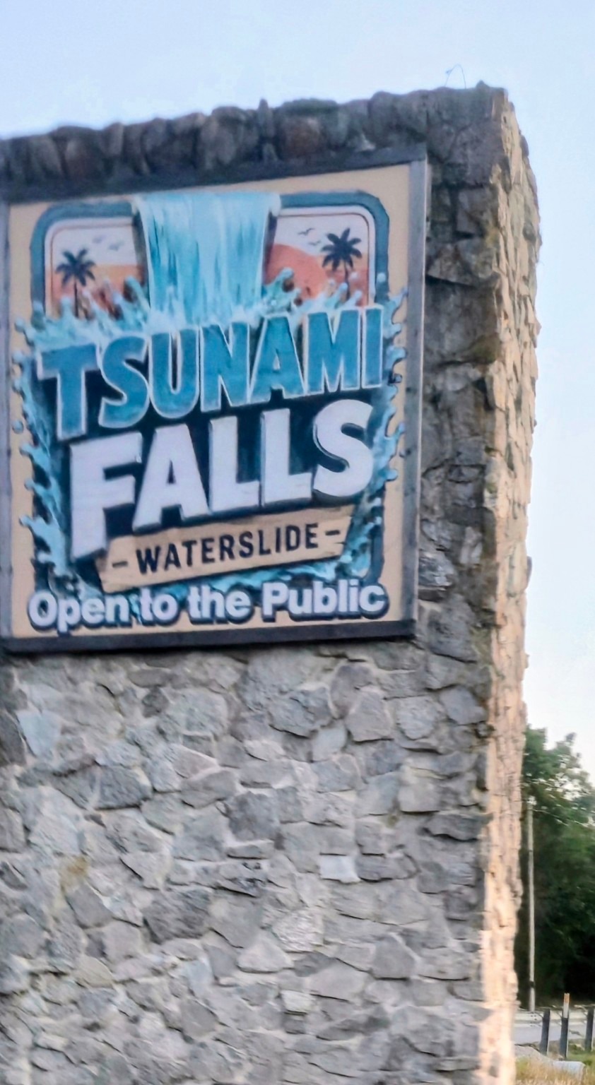 Tsunami Falls waterslide sign